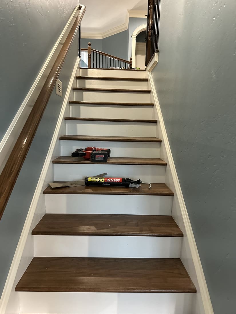 Hardwood stairs with travertine rebuild